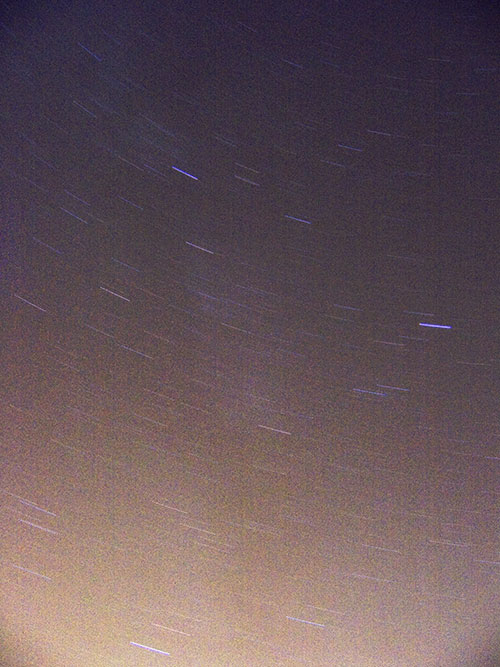 the result of simply adding up the 20 photos, causing star trails.